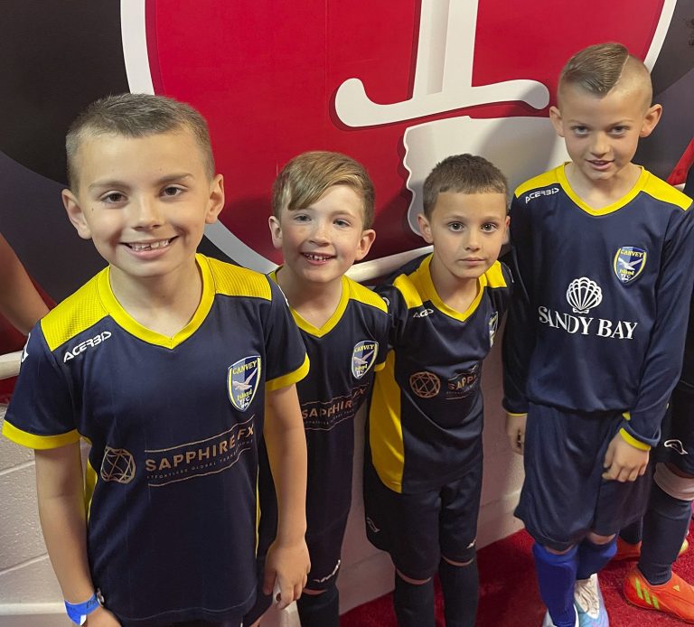 four boys in sapphire fx branded canvey island youth fc kits